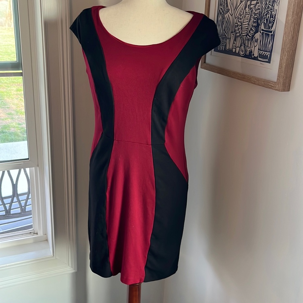 Mid length XOXO form fitted red and black dress. Size 11-12